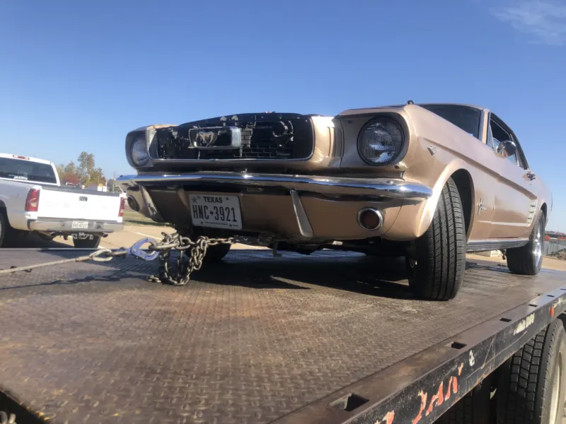 Classic Ford Mustang on a Dallas Towing Company flatbed