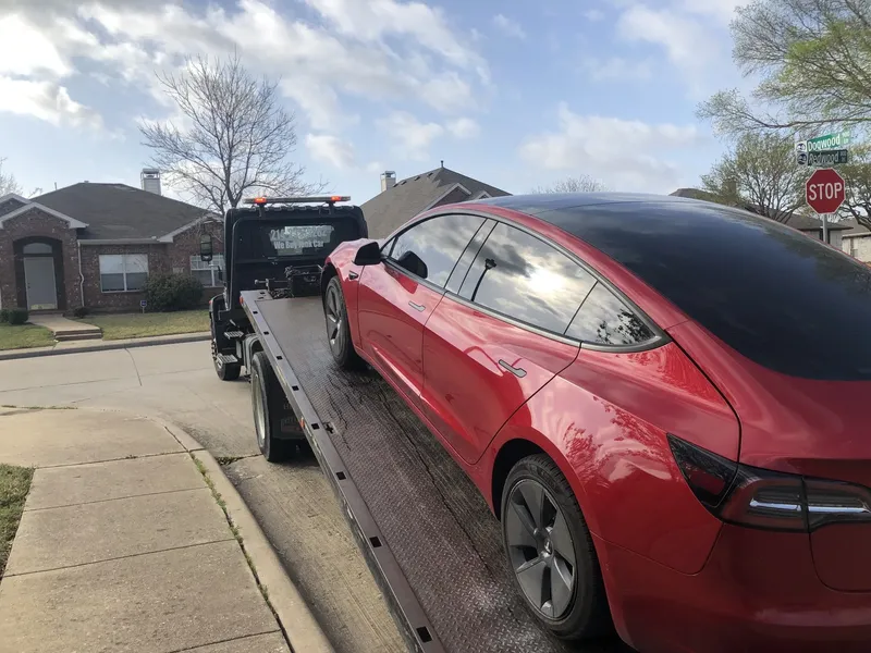 Tesla Model 3 on a Dallas Towing Company flatbed for EV towing in Dallas, TX
