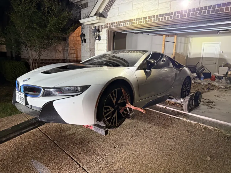 BMW i8 on wheel dollies for towing in Dallas, TX