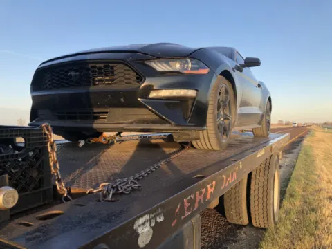 Ford Mustang secured for long distance towing from Dallas, TX