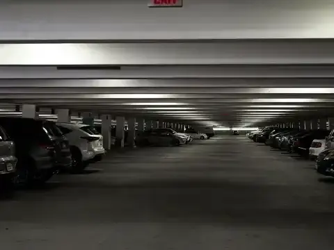 Car being towed from a parking garage in Dallas, TX